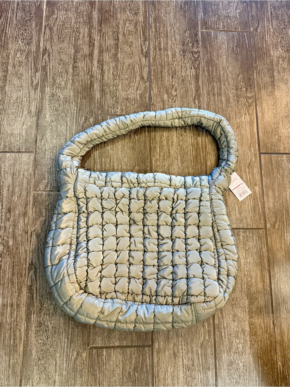 NWT green puffer bag.